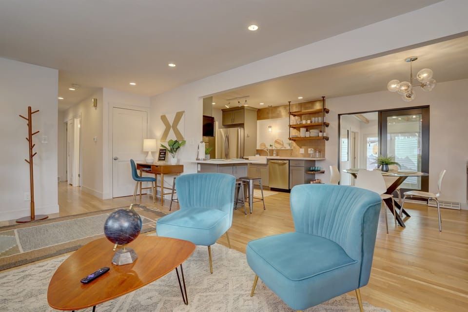 The openess of the living room, dining, and kitchen is perfect for spending time with the family.