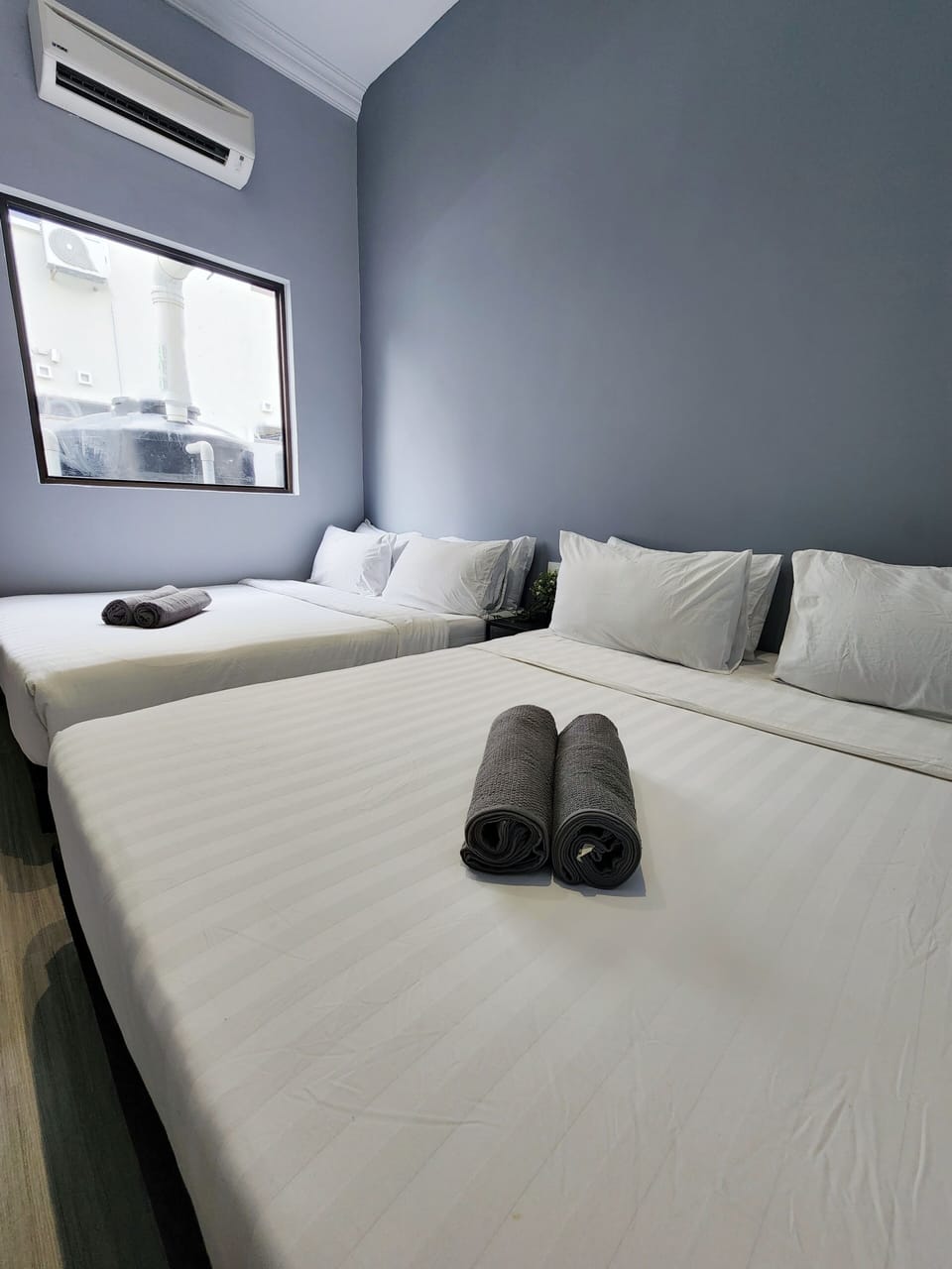 Family Quadruple Room | Blackout drapes, iron/ironing board, free WiFi, bed sheets