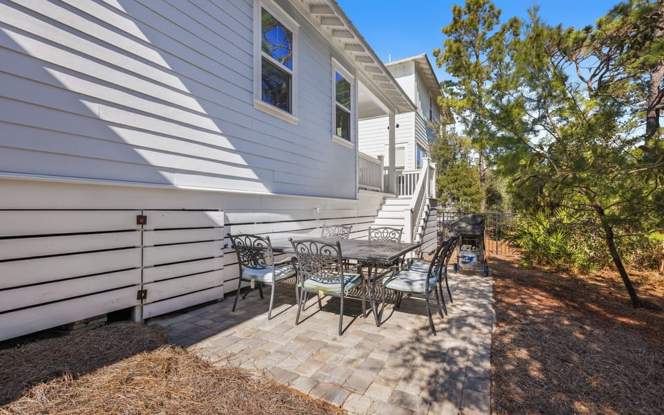Your private patio offers the perfect spot for morning coffee or evening gatherings under dappled shade.