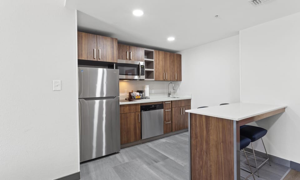 Suite, 1 King Bed, Non Smoking | Private kitchen | Fridge, microwave, coffee/tea maker