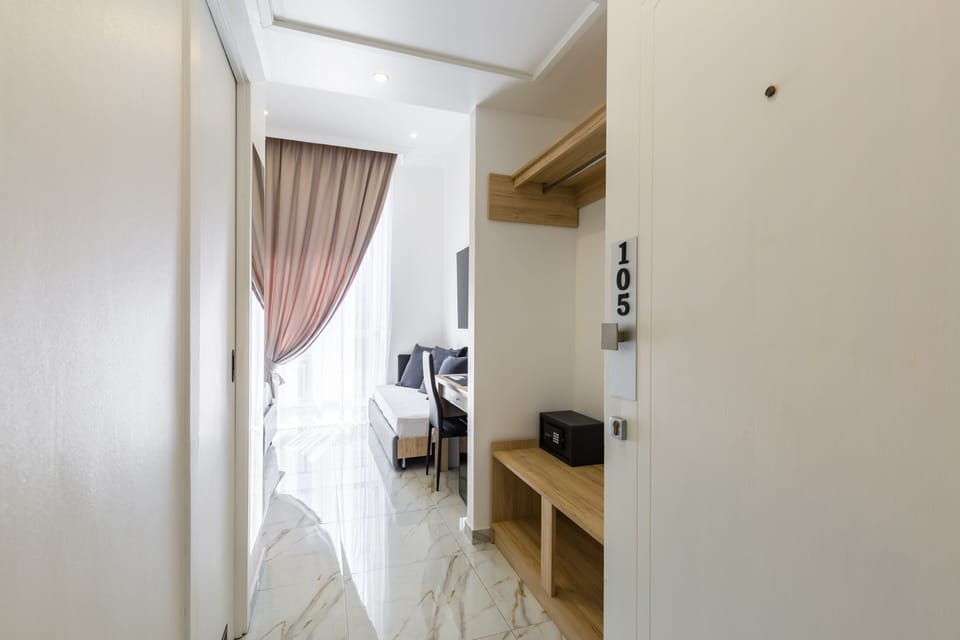 Comfort Triple Room (Vesuvio View) | Down comforters, minibar, in-room safe, blackout drapes
