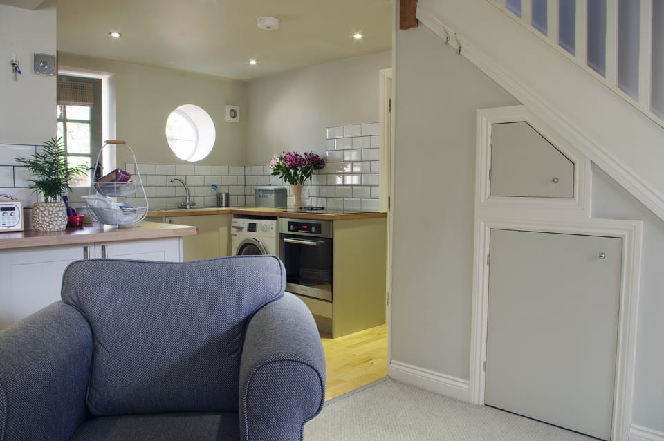 Beautiful lounge with dining and kitchen area at The Hay Loft in Bishopton, Ripon