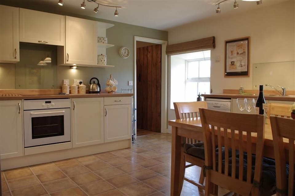 Kitchen with dining area at Hill Top Cottage in Walden dale near West Burton in the Yorkshire Dales