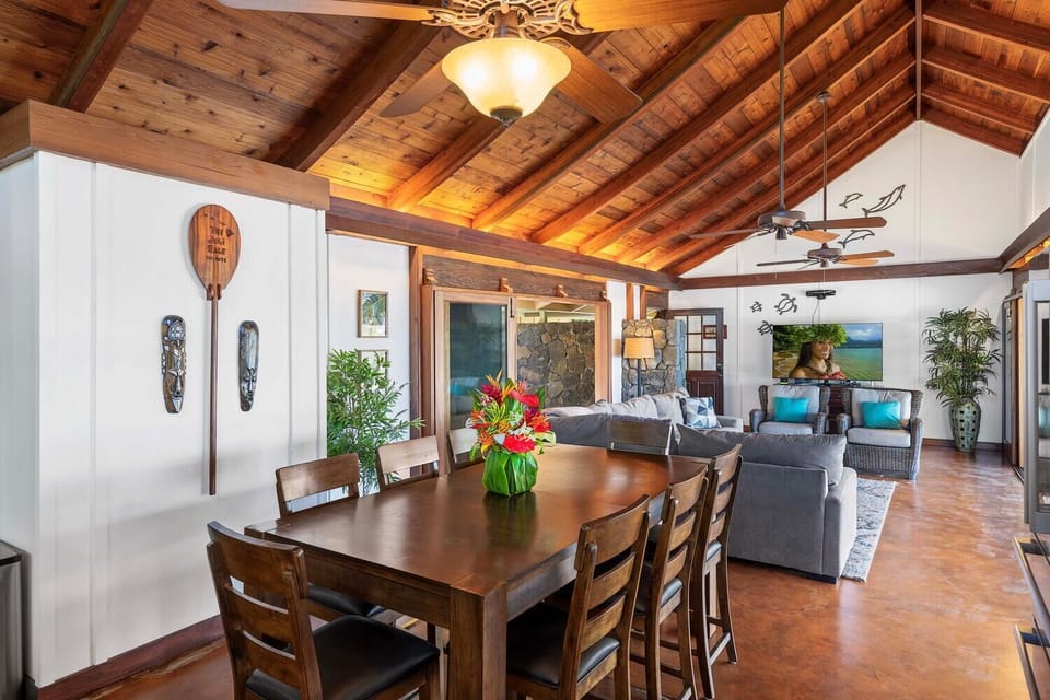 Spacious open-plan living and dining area with island charm.