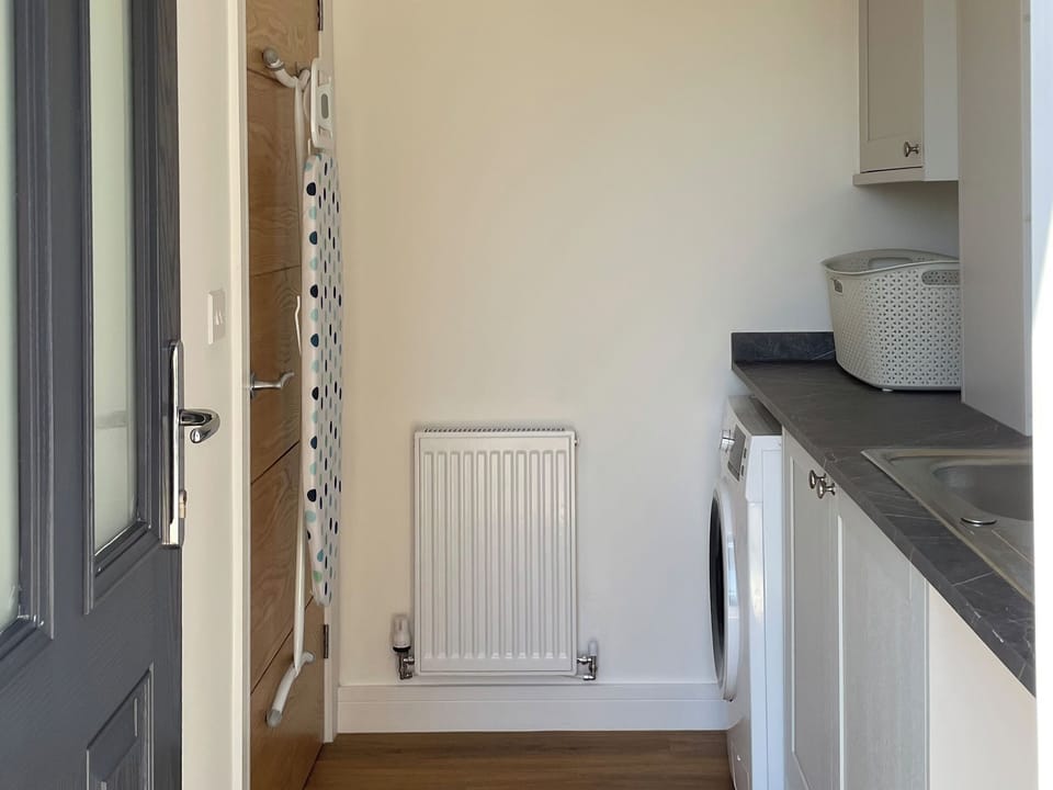 With a separate entrance from the driveway, our utility is perfect for muddy boots | Bay Tree House, Buxton