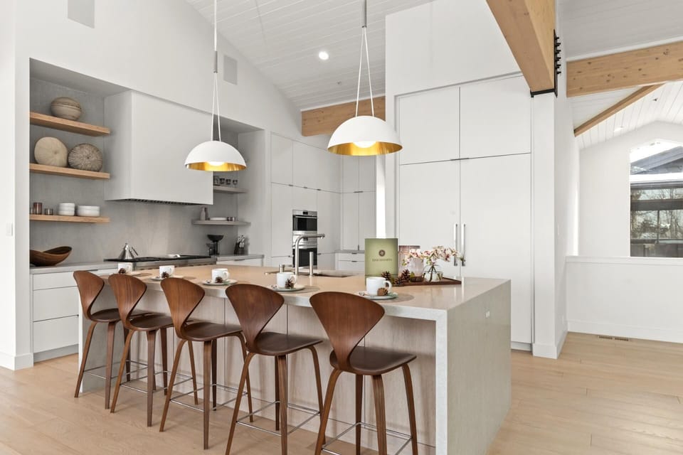 Bar seating for five and modern pendant lights make casual meals and conversation easy.