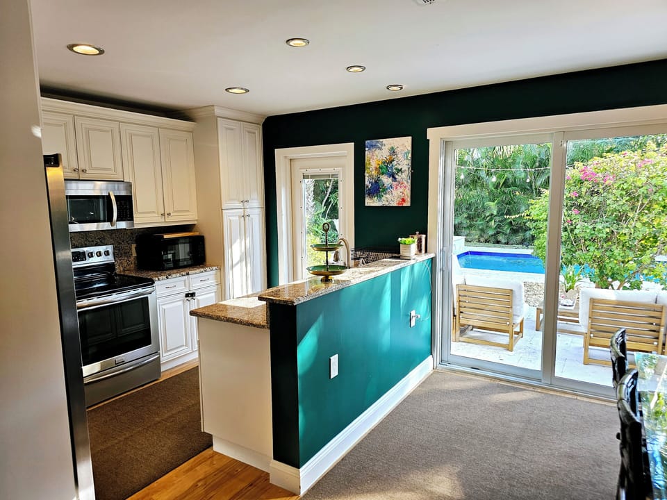 Kitchen, dining room all opening to the pool area 