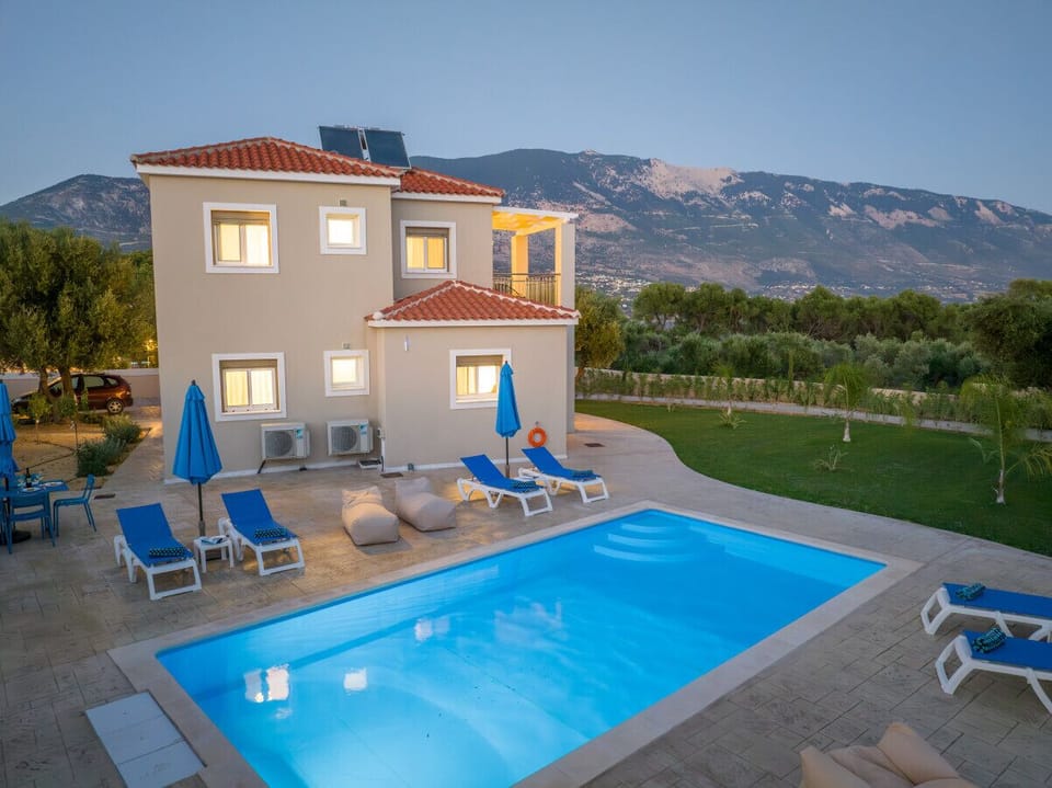 Mount Ainos Provides a Majestic Backdrop while Lounging in the Pool