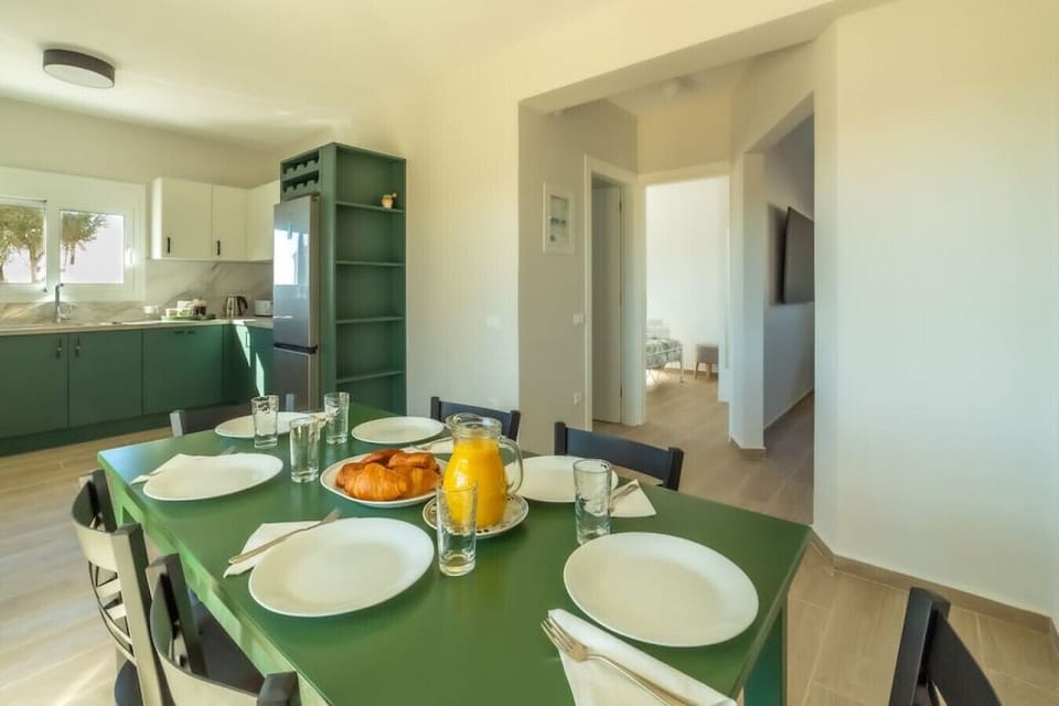 An open floor plan provides large kitchen and dining for six on the ground floor