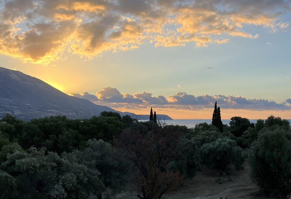 Watch the sun rise over the mountains and sea from the balcony