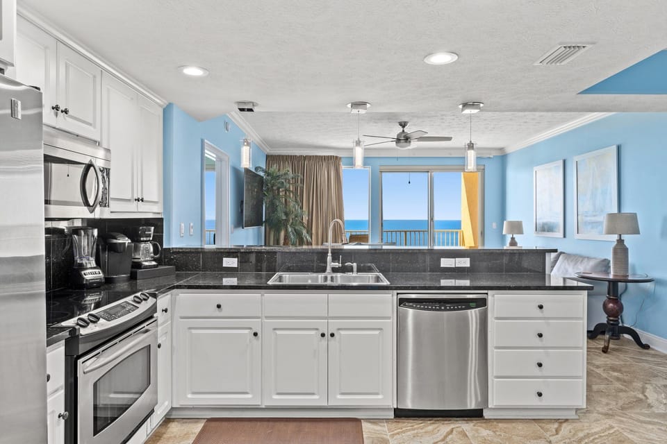 Modern kitchen with ocean views and stainless steel appliances