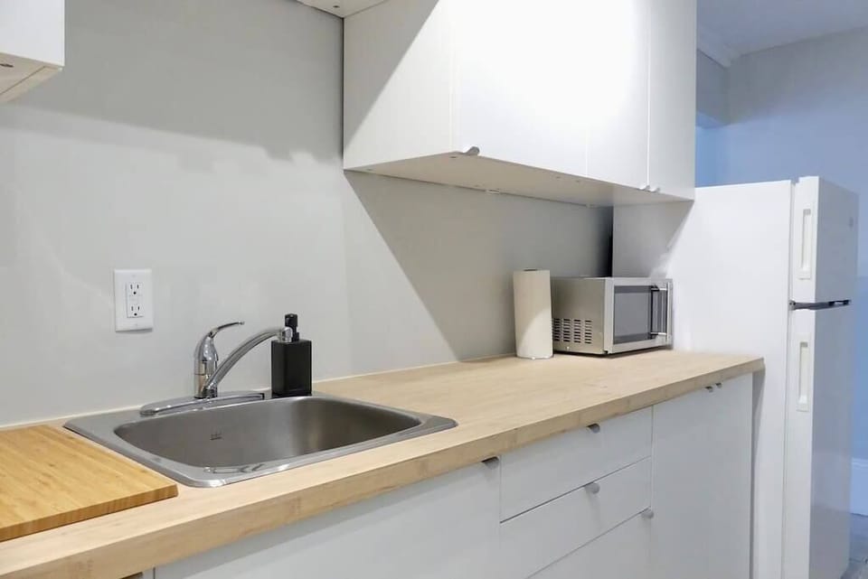 Kitchen is galley style, and newly updated! brand new cabinets, and counters!