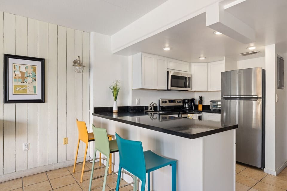 Sleek kitchen & dining space w/ modern finishes for effortless meals.