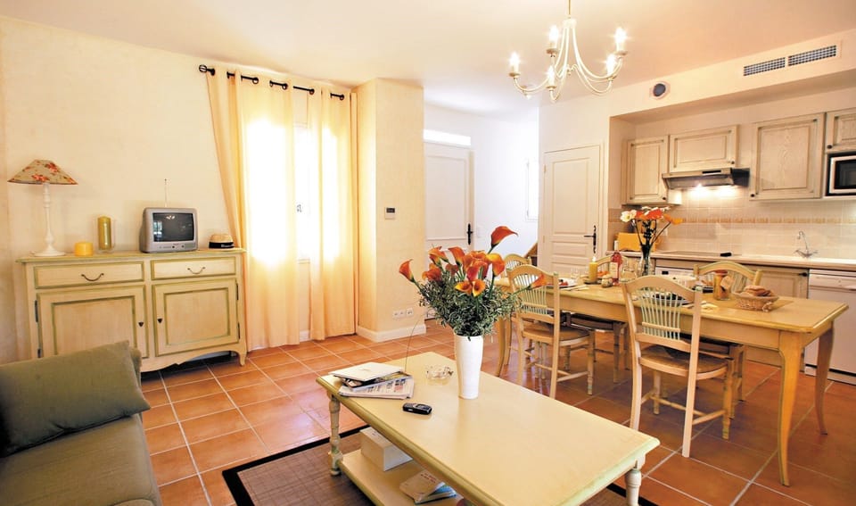Prepare meals in the kitchenette and enjoy them at the dining table.