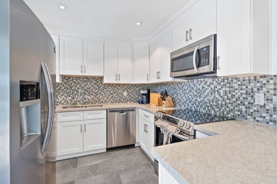 Stainless steel steals the show in this minimalist kitchen.