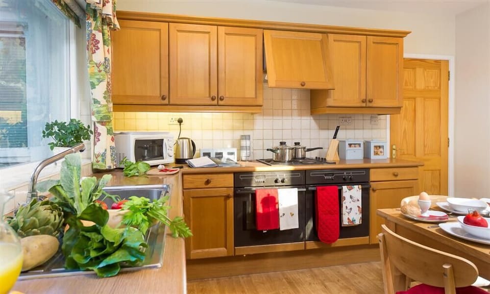 Fridge, microwave, cookware/dishes/utensils