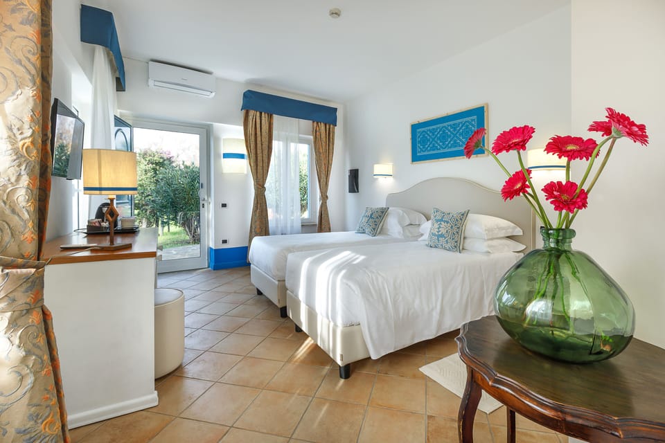 Deluxe Double or Twin Room, Non Smoking | Bathroom | Shower, rainfall showerhead, hair dryer, slippers