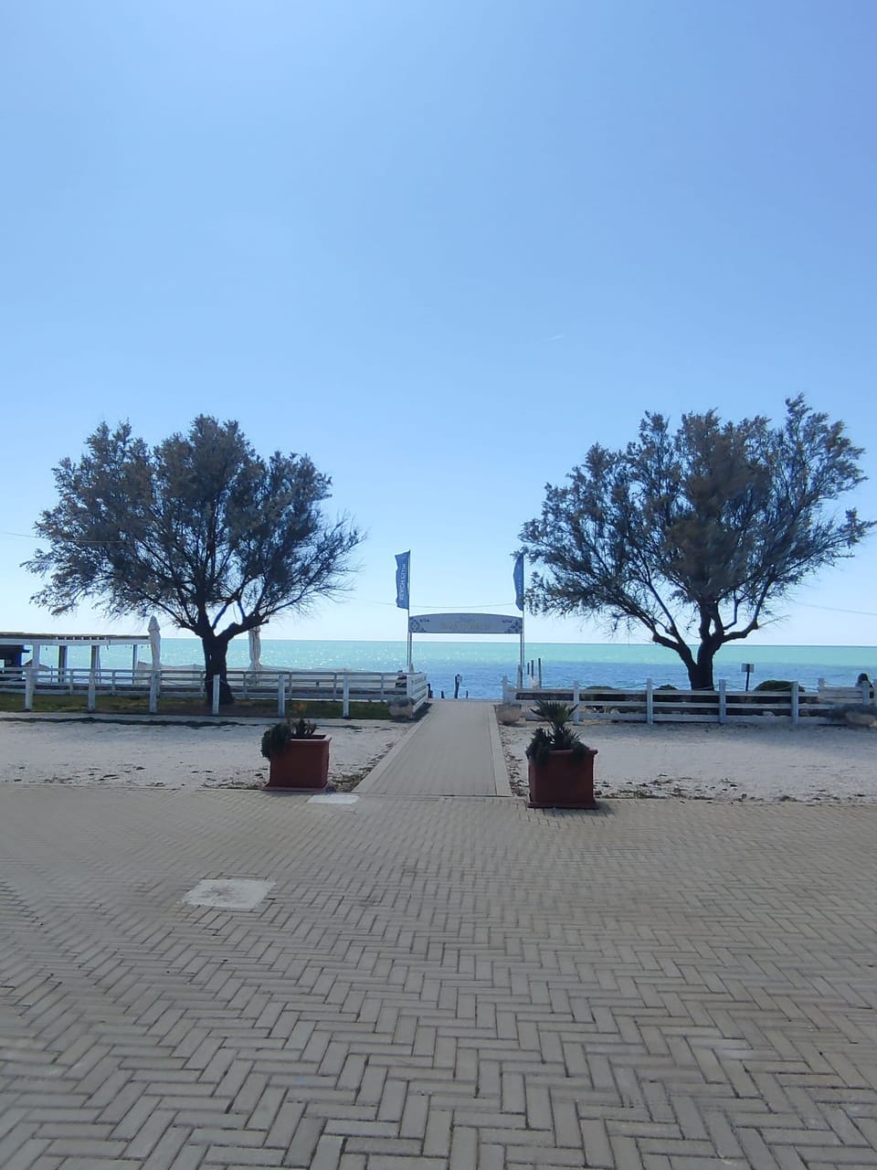 Private beach, black sand, sun loungers, beach umbrellas