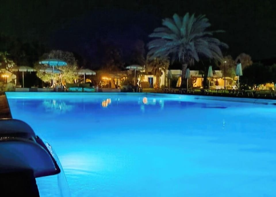 Outdoor pool, open 9:00 AM to 7:00 PM, pool umbrellas, sun loungers