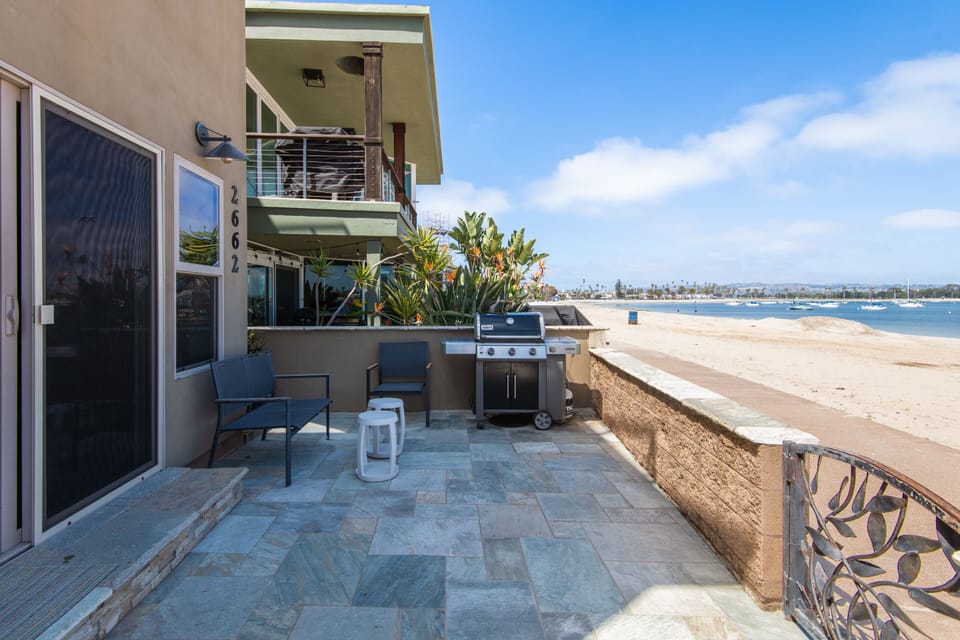 Savor a BBQ experience overlooking the bay, using a premium grill.