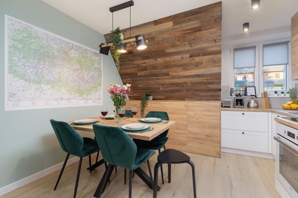 Large table with chairs for eating communal meals. 