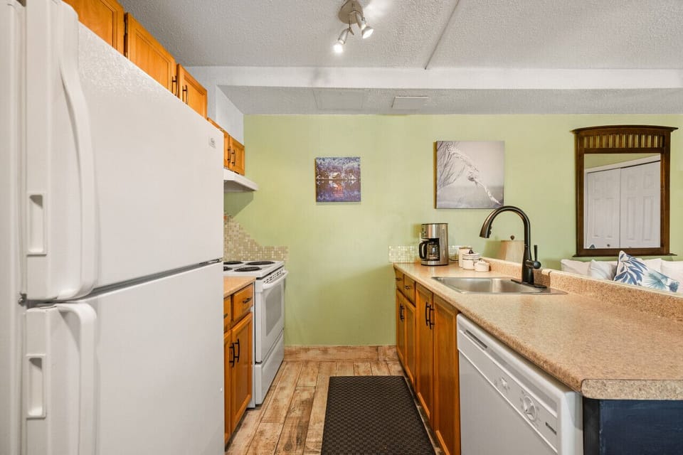 Full kitchen with a drip coffee maker, blender, crockpot & more.
