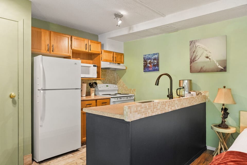 Full kitchen with a drip coffee maker, blender, crockpot & more.