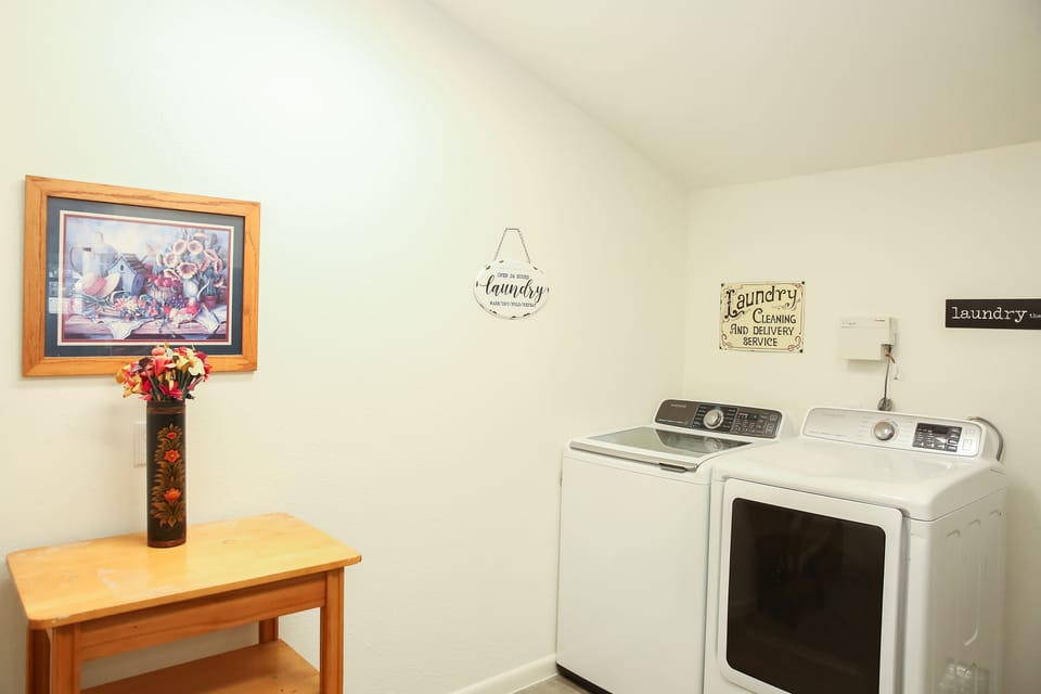 Laundry Room - Full washer and dryer with additional refrigerator.