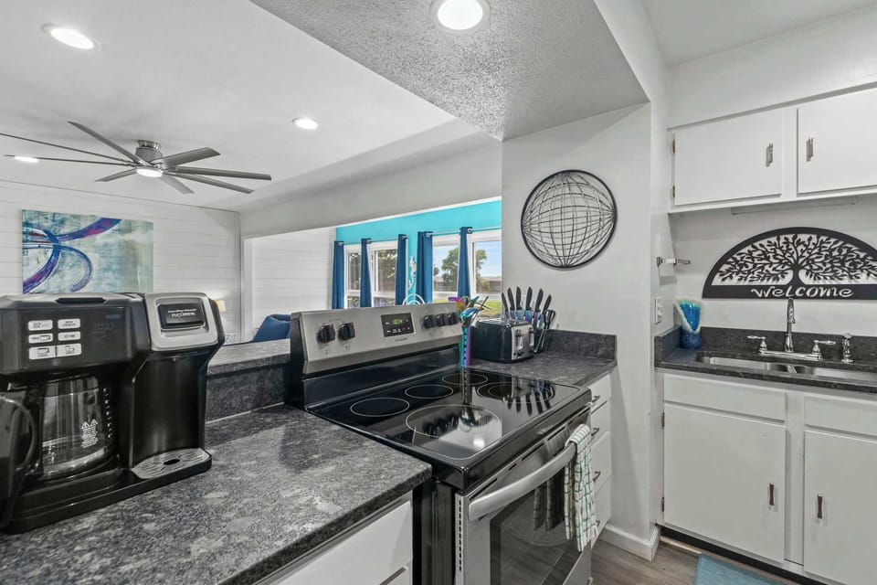 We've stocked this kitchen with full appliances, dishes, bake ware, pots & pans, silverware, utensils, crockpot, blender, and a traditional coffee maker & Keurig!