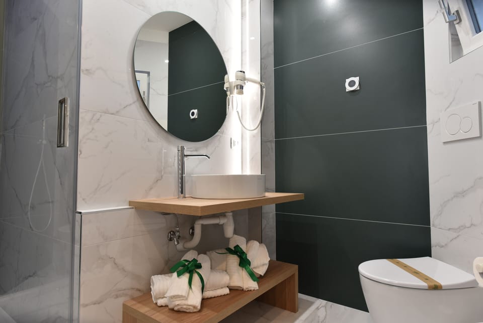 Superior Triple Room, 1 Queen Bed with Sofa bed, Non Smoking, City View | Bathroom | Shower, rainfall showerhead, free toiletries, hair dryer