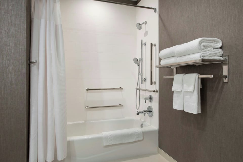Combined shower/tub, hair dryer, towels, soap