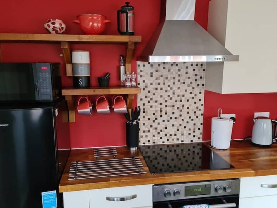 Kitchen including microwave, fridge-freezer, oven and washing machine