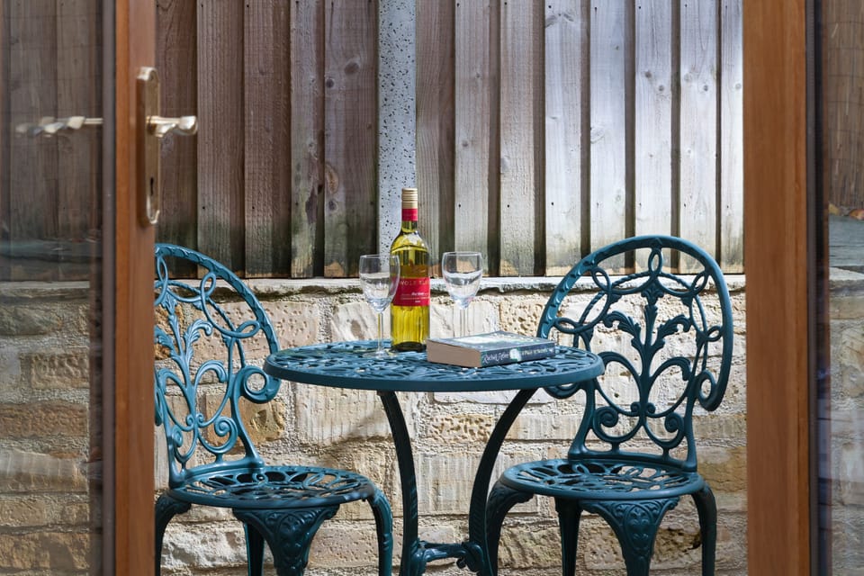 Forge Cottage, Winchcombe: Patio area leading to the secret garden