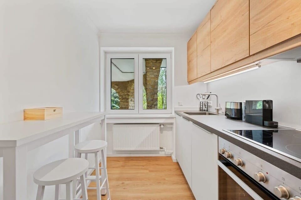 Modern kitchen and dining area, perfect for enjoying meals with a view.