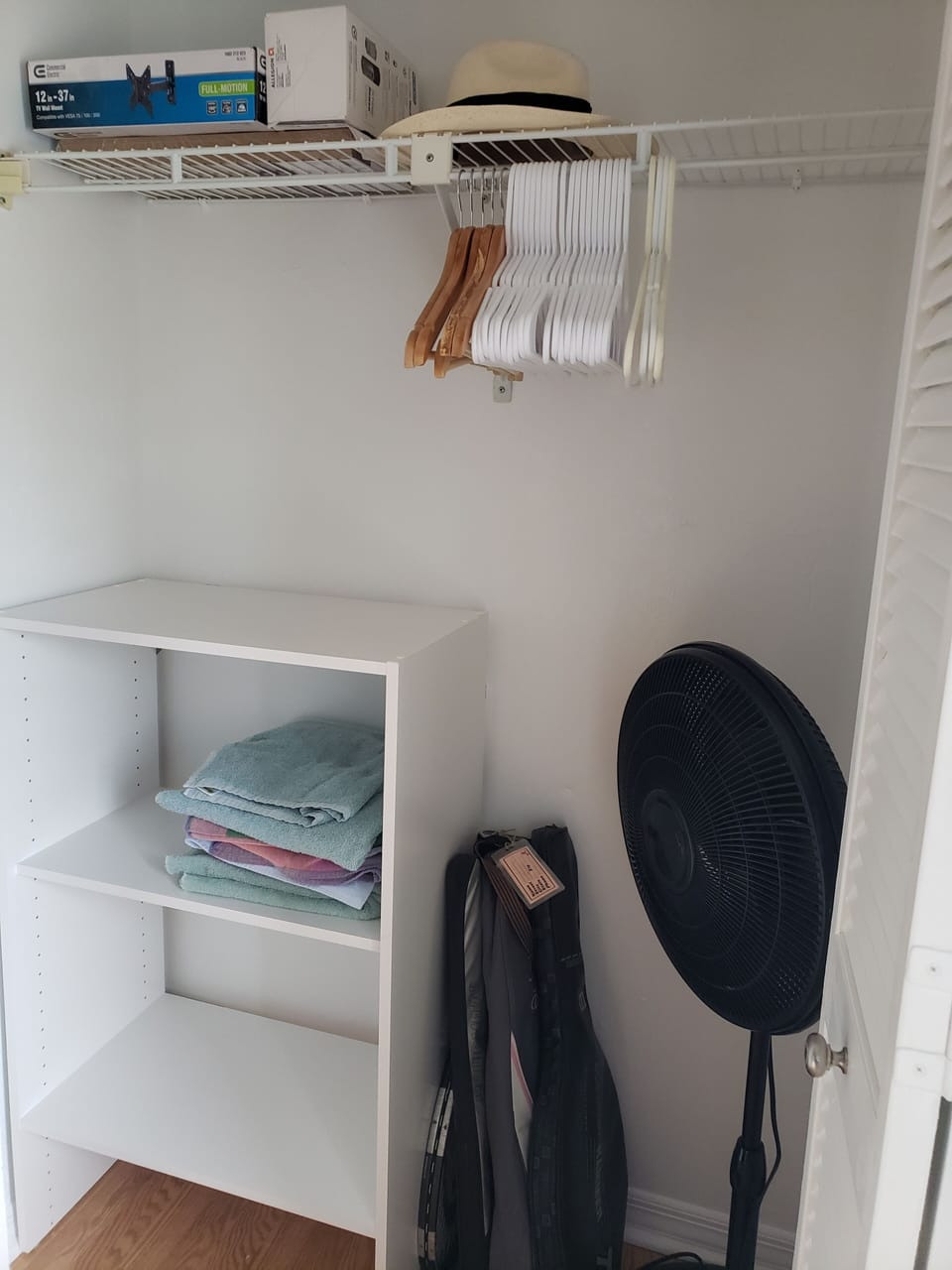 Closet with tennis rackets in Twin Bedroom