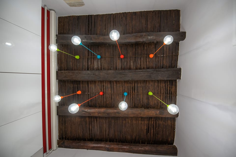 Deluxe Condo | Living area | 40-inch flat-screen TV with cable channels, TV