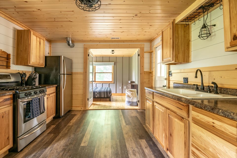 Galley kitchen is fully stocked. No dishwasher