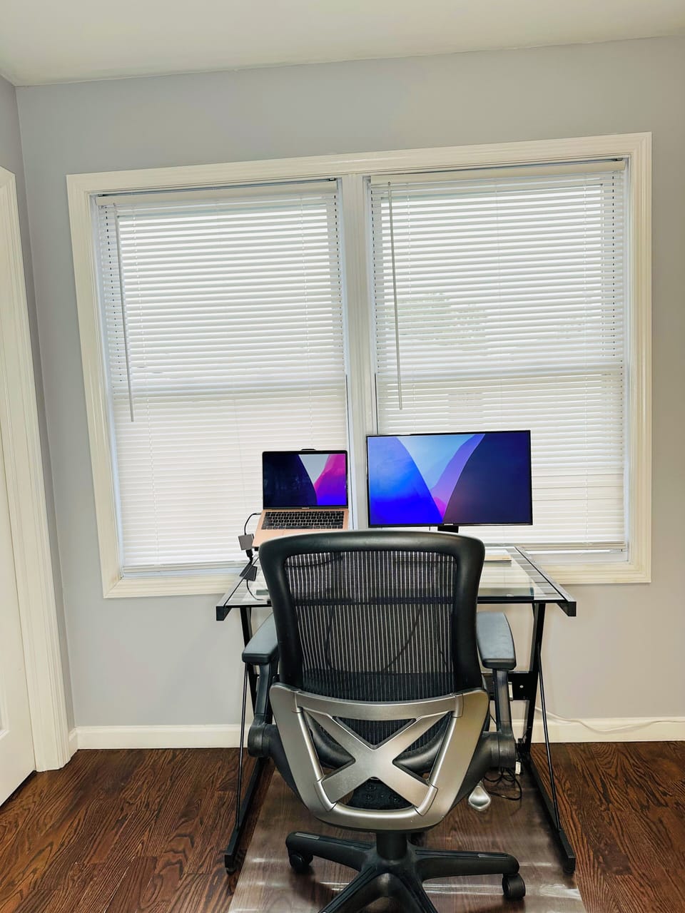 Bedroom 1: Remote workspace equipped with a monitor and smart hub connections