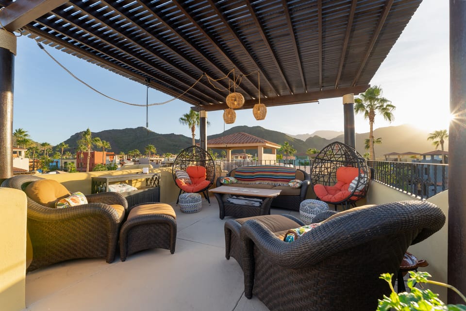 3rd floor tower seating Area / Seating for 9/ Pergola/ Pull down shades/ Gorgeous Mountain Views.