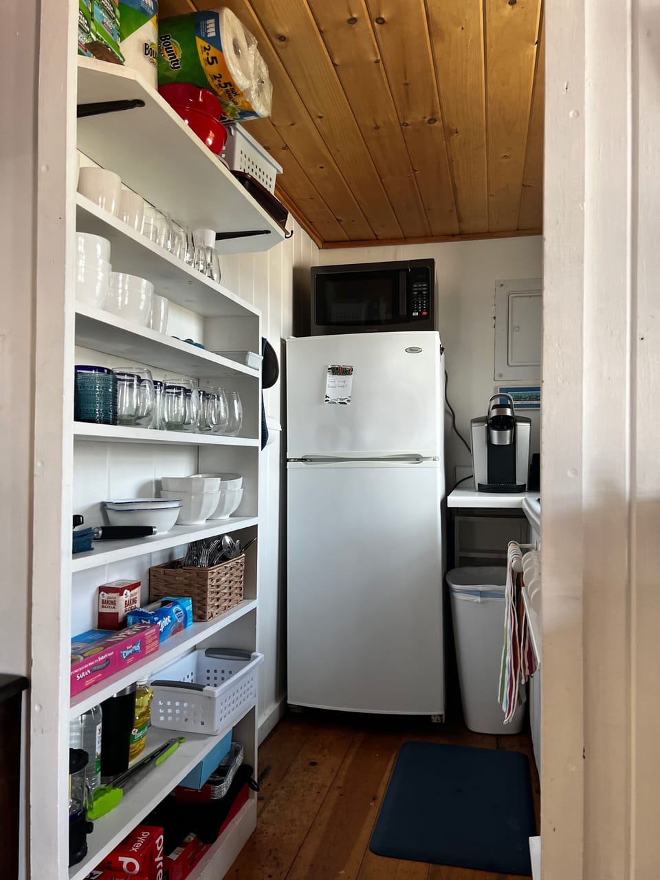 Galley kitchen w/ microwave, full refrigerator, electric stove top and gas oven 