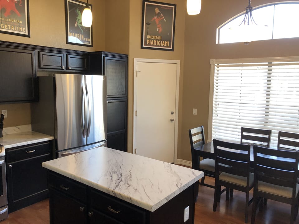 Kitchen fridge with water and ice dispenser inside. 