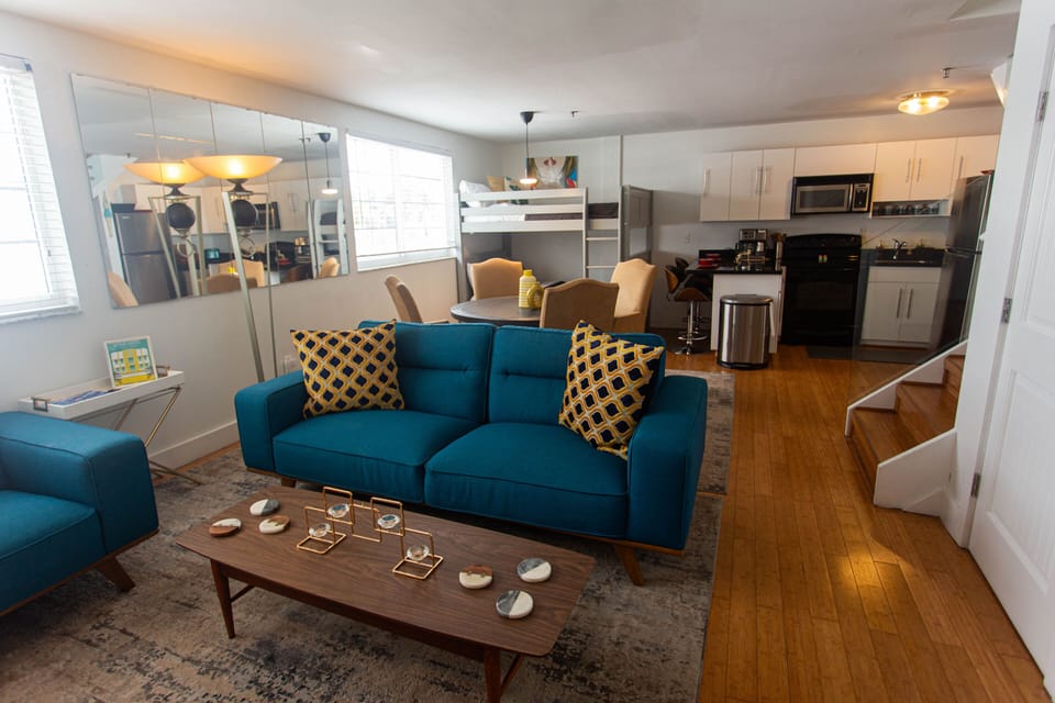 Large living room, dining area, bunk bed and kitchen