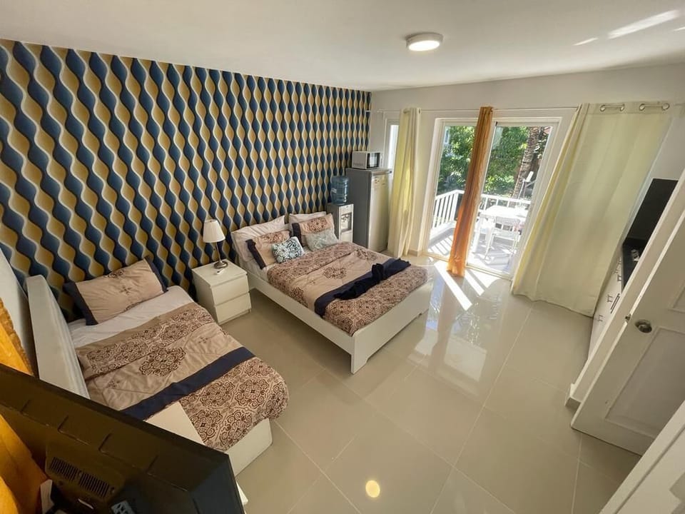 Deluxe Apartment, Multiple Beds, Pool View | Down comforters, WiFi (free), individually decorated