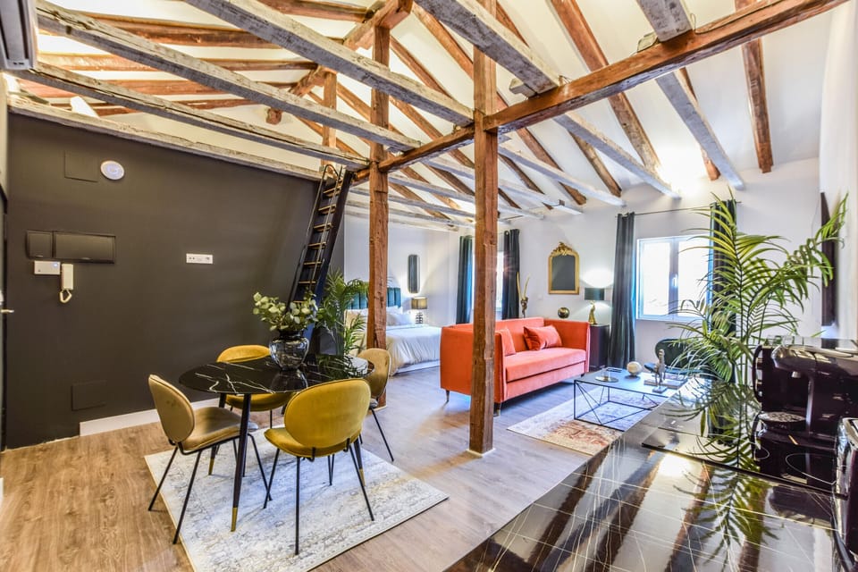 View of the dining area and open space of the living room and bedroom