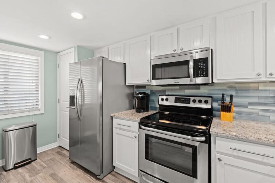 Gorgeous updated kitchen. Granite counters, stainless steel appliances, & fully-stocked for your stay.