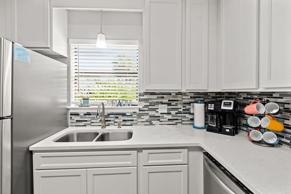 Gorgeous updated kitchen with breakfast bar (seats 3), stainless steel appliances, and fully-stocked for guest stay