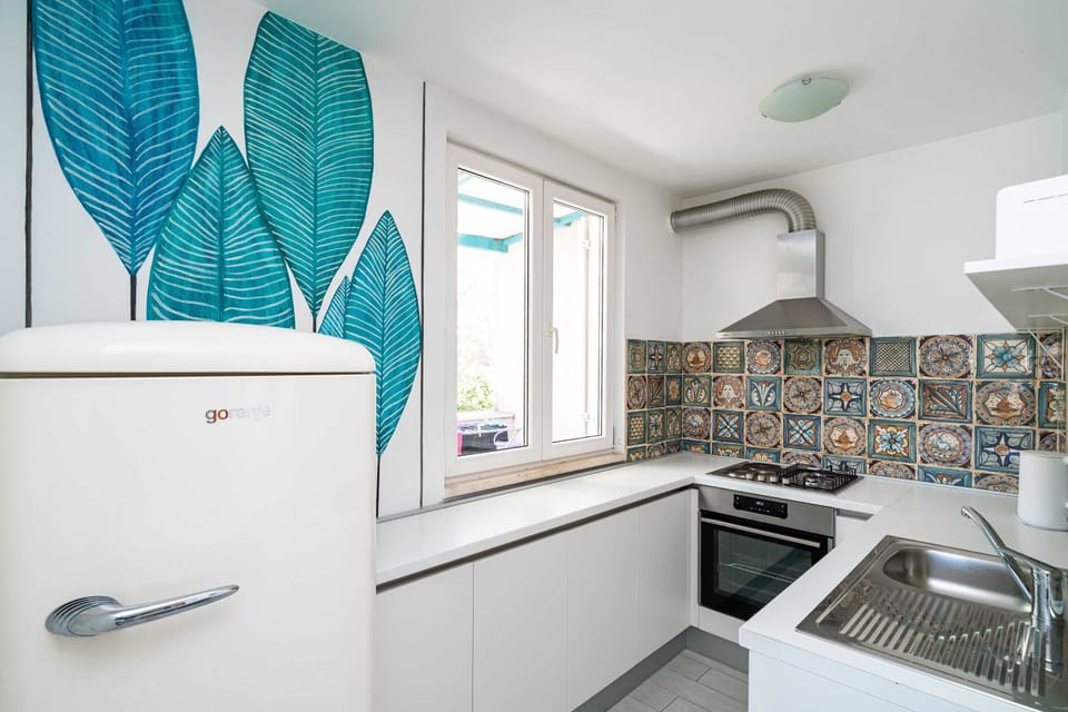 Apartment (One-Bedroom Apartment with Balcony an) | Private kitchen | Fridge