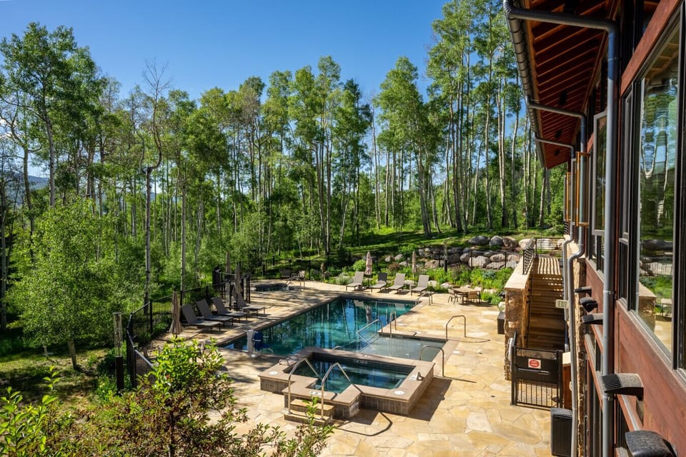 Shared heated pool and hot tubs at The Aspen House Clubhouse - Open all year!