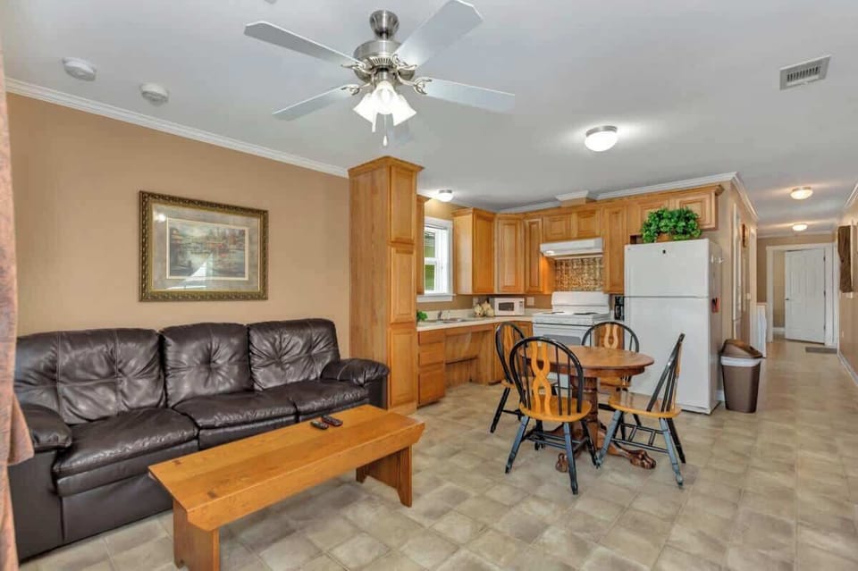 The living room area opens up into the kitchen and dining area 
