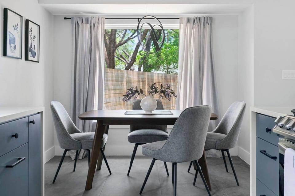 Bright dining nook with modern seating and a view of the backyard — perfect for morning coffee or enjoying dinner together